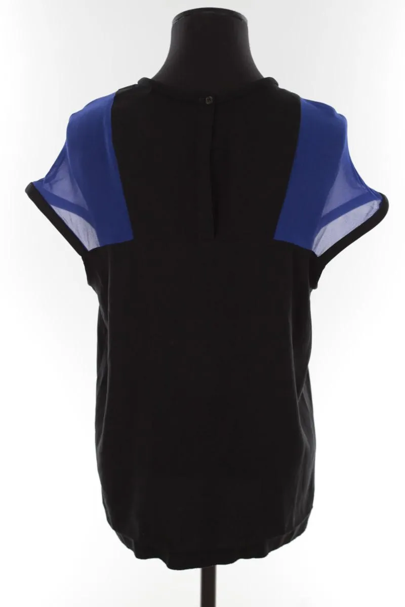 Top noir Maje noir. Matière principale polyester. Taille 40